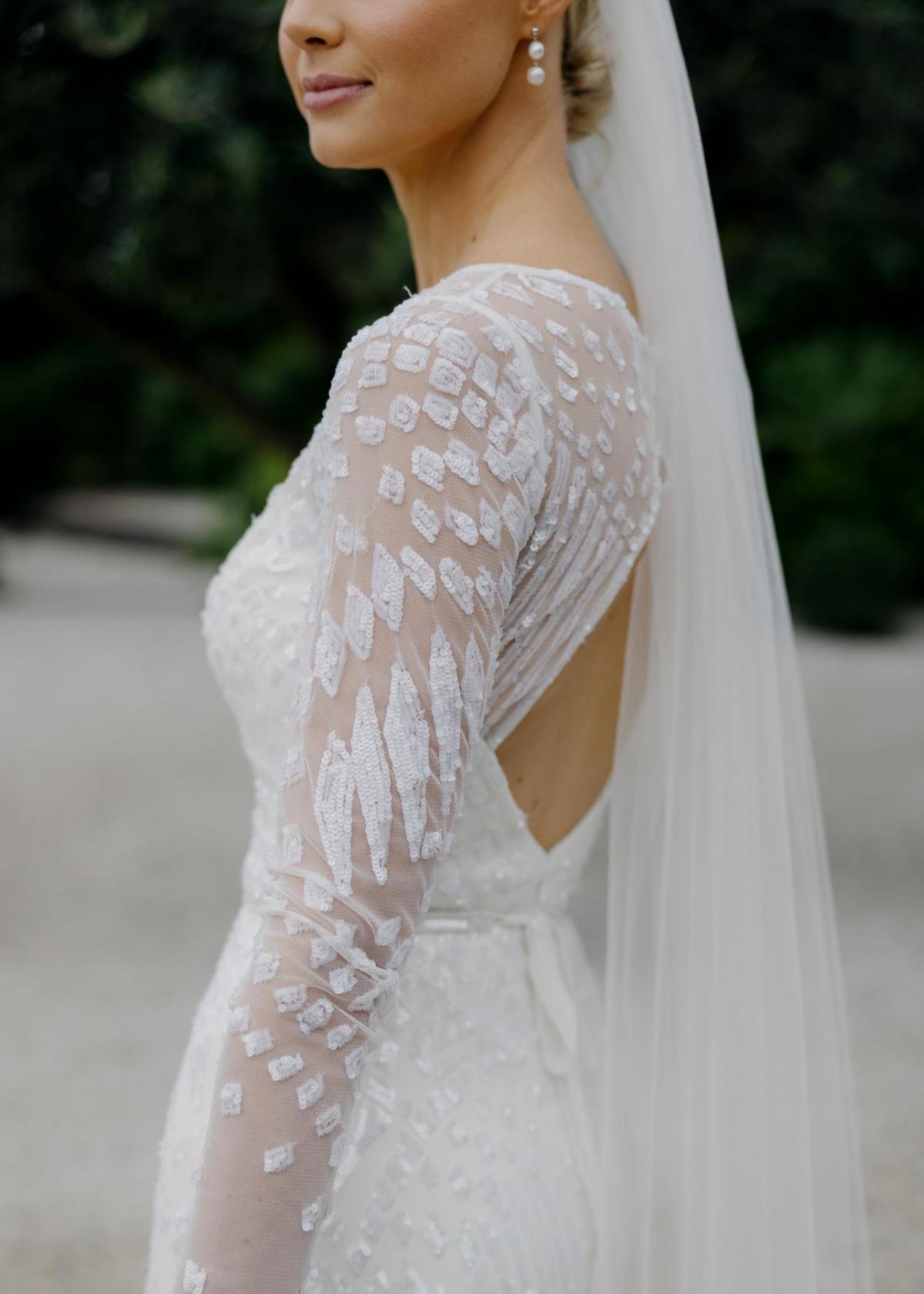KWH real bride Taylor up close image of her intricate sequin details of her Lexie gown.
