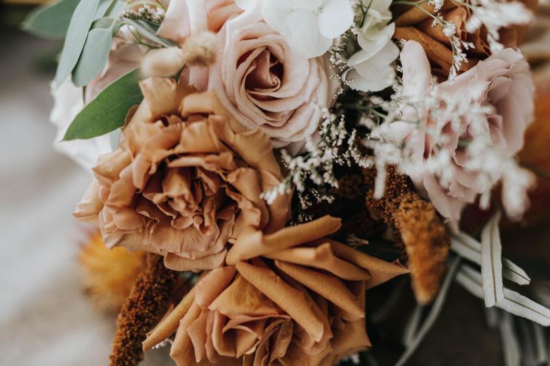 Up close image of KWH real bride Ashleigh's burnt orange and blush roses by The Floral Criteria.