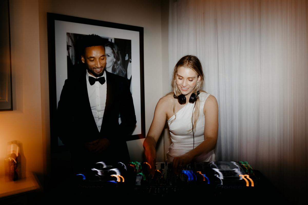 KWH real bride Demi showing off her DJ skills at her hotel afterparty.