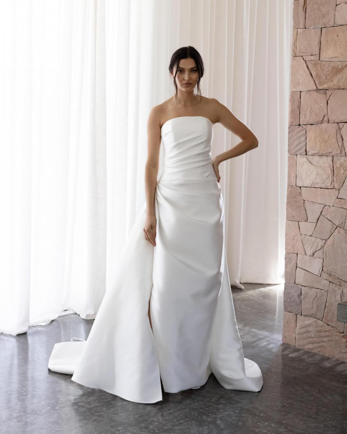 The Catalina gown by Karen Willis Holmes, a strapless simple wedding dress with an A-Line skirt.