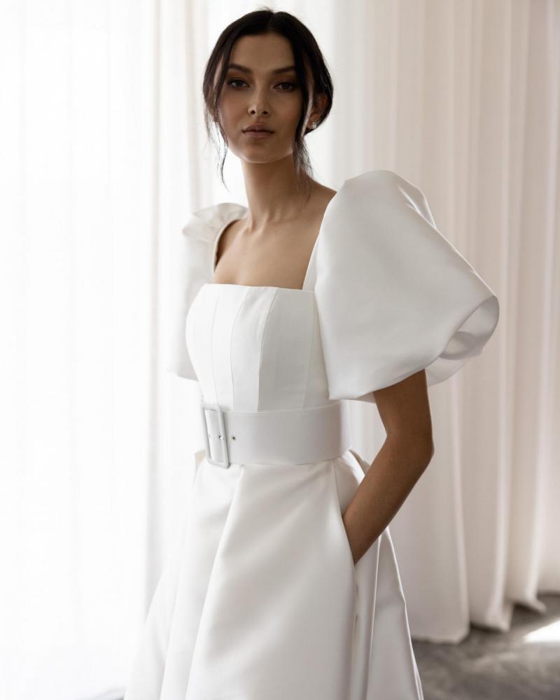 The Diana bodice and Elizabeth Skirt by Karen Willis Holmes, a simple, straight neckline wedding dress with a traditional A line skirt with pockets with straps and an open back