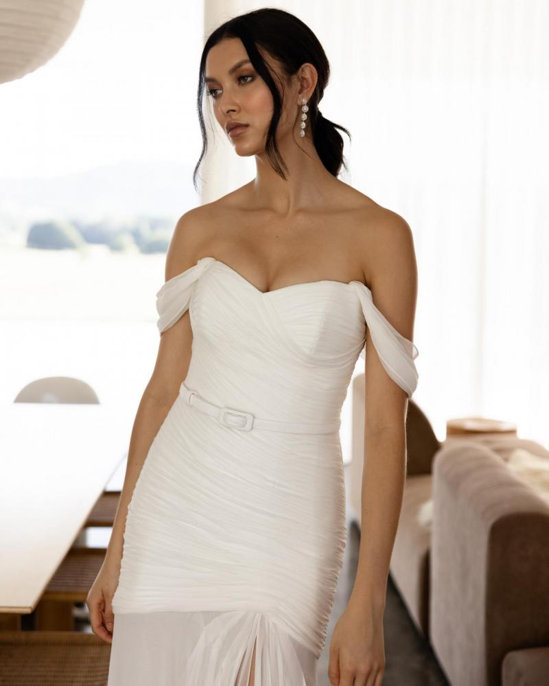 The Stephanie gown by Karen Willis Holmes, an off the shoulder ruched wedding dress with a sweetheart neckline.