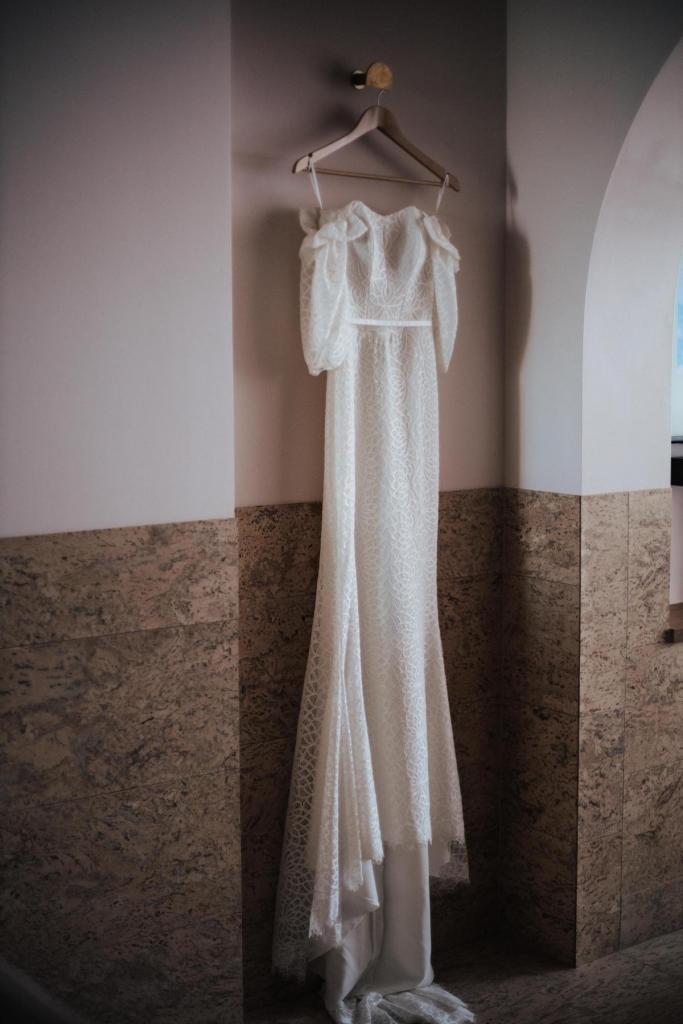 KWH real bride Tess's long lace wedding dress, Vivienne, hanging in the Calile hotel.