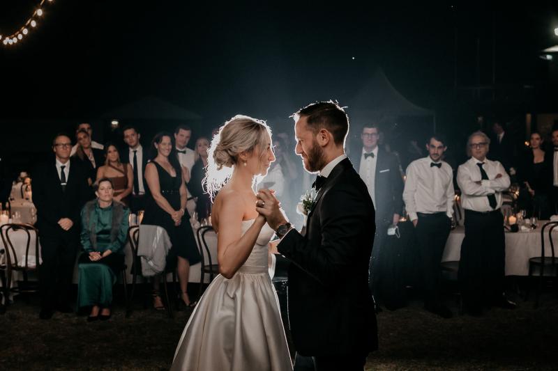 KWH real bride Genevieve and Kyle have their first dance. She wears the timeless Blake Camille wedding dress with structured bodice.