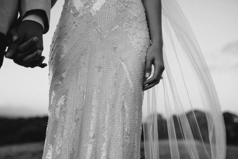 Detail shot of KWH real bride Georgie's Fontanne gown, a v-neck art deco fit and flare wedding dress.