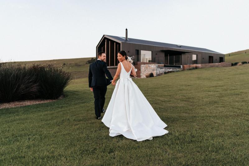 Real bride Ancille getting ready for her church wedding, wearing the Kitty Melanie gown by Karen Willis Holmes with sweetheart neckline.