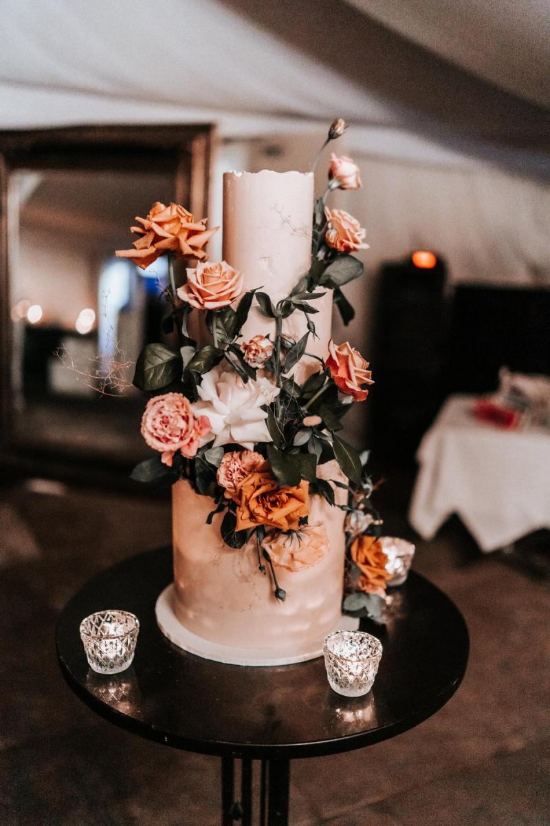 KWH real bride Katherine's three tier wedding dress with orange roses.