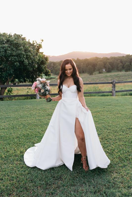 KWH real bride Hannah shows off her Blake Camille gown, a modern aline wedding dress with leg split.
