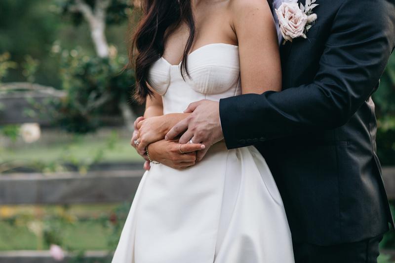 Upclose detail shot of KWH real bride Hannah's bodice on her Blake Camille gown, a modern strapless aline wedding dress.