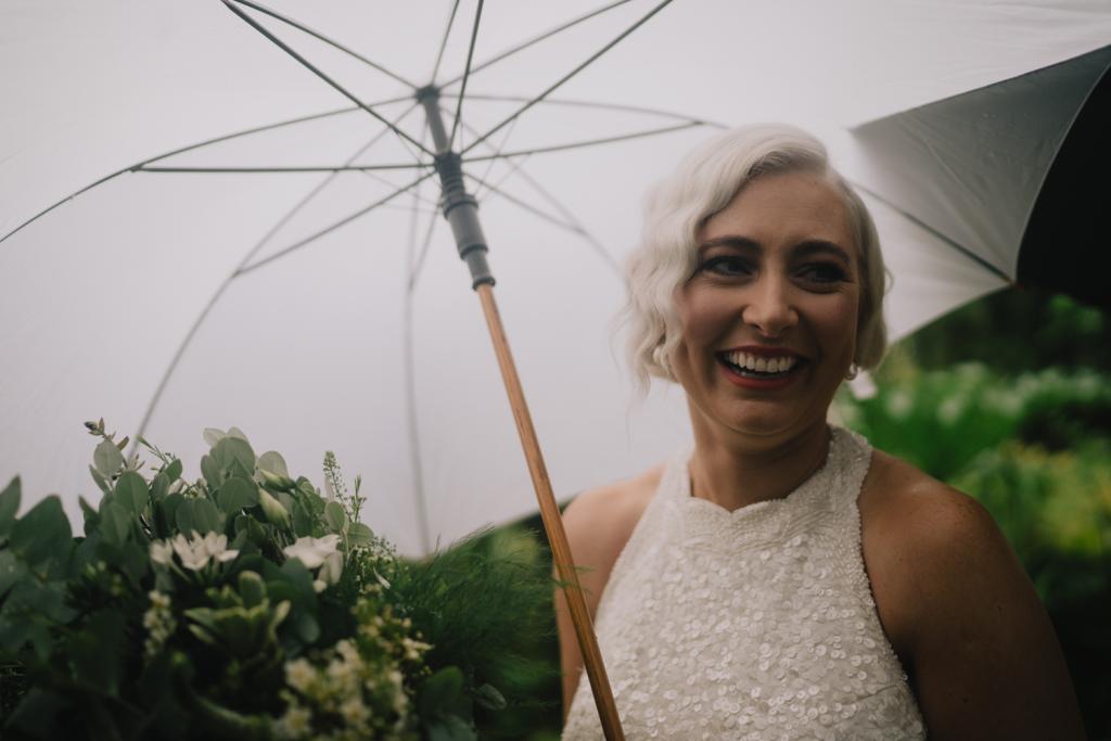 KWH real bride Laura hangs out under the Umbrella in her Cindy gown, halter neck sequin wedding dress.