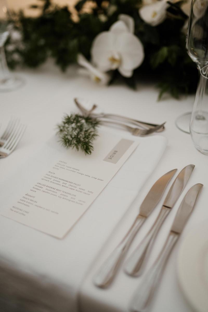 Minimalist details of KWH real bride Jacqui's reception table with white daisies.