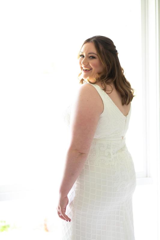 KWH real bride Meg wears her Bobby gown, a curve fit and flare lace wedding dress.