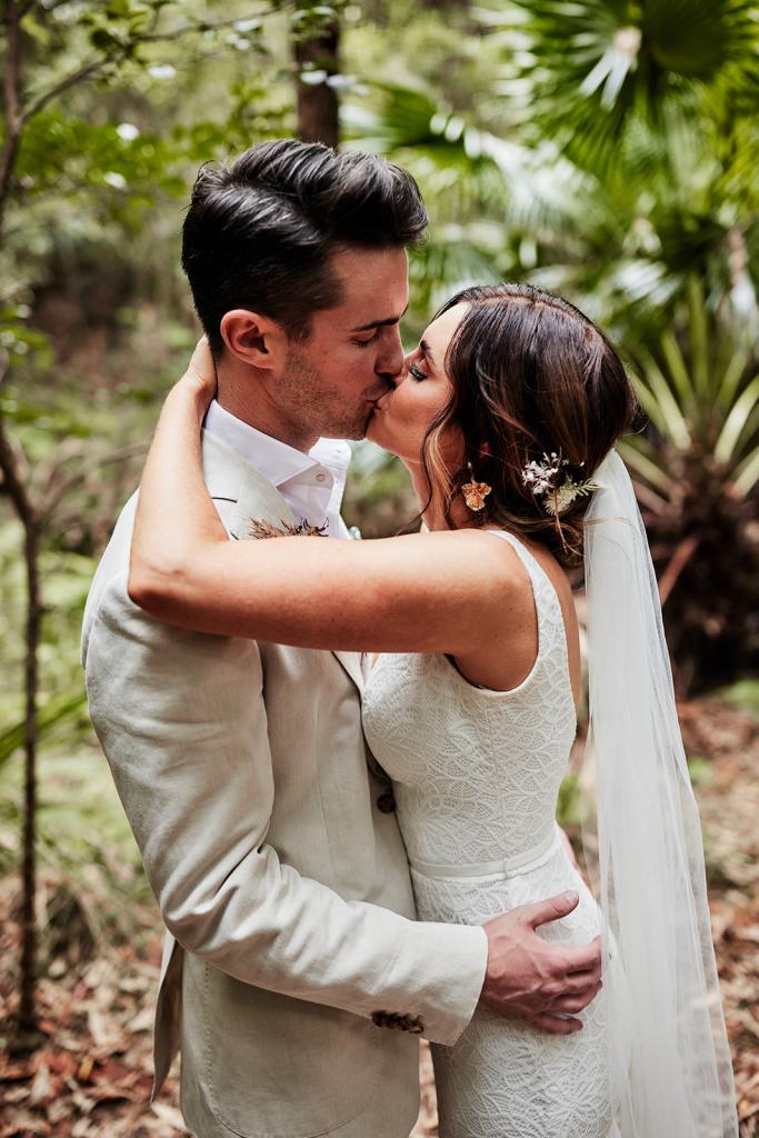 KWH real bride Emma kisses will in her Rylie gown, a modern fit and flare wedding dress.
