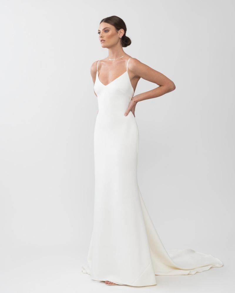 The Isadora gown by Karen Willis Holmes; a simple crepe v-neck wedding dress with long train.