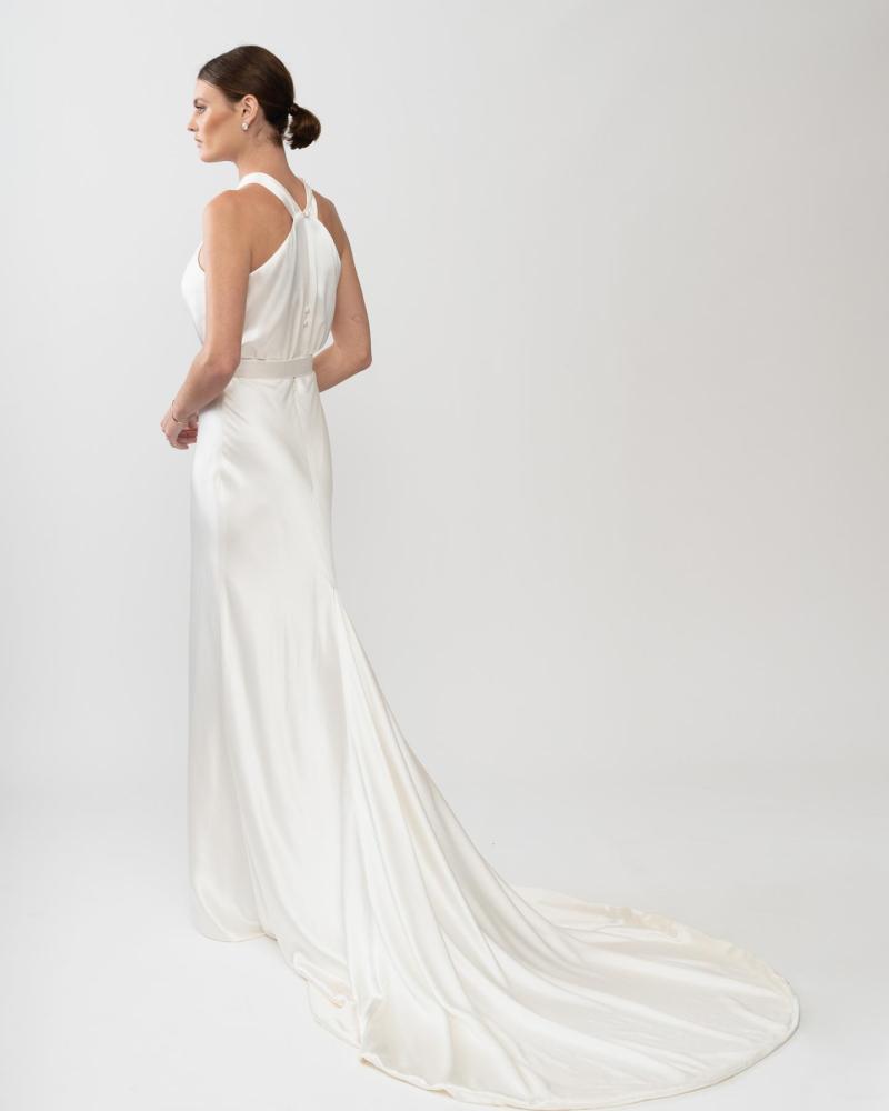 The alluring back of the Tammy gown by Karen Willis Holmes, a minimalist satin silk wedding dress with fit and flare silhouette.