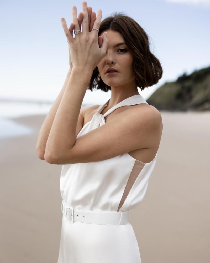 Stunning side slit detail of the Tammy gown by Karen Willis Holmes, a minimalist satin silk halter wedding dress.