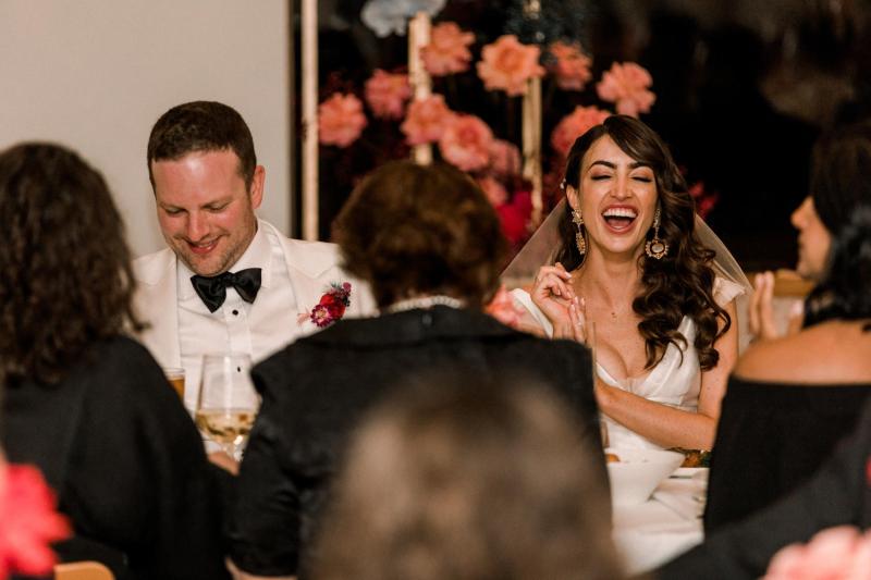 B&W image of KWH real bride Josey and Brad kissing. she wears the modern Taryn Camille gown, a timeless aline wedding dress with custom cap sleeves.