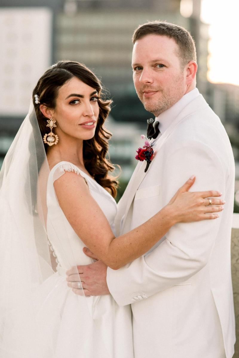 KWH Real bride Josey and Brad posing as she wears her Taryn Camille gown with customizations.