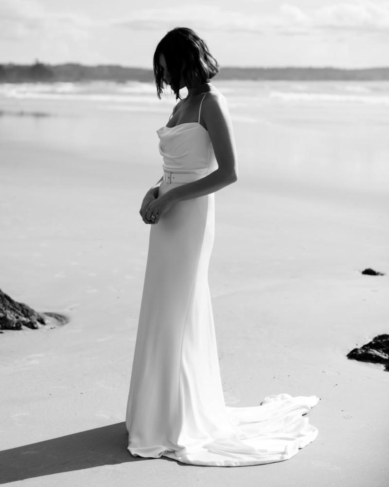 The Tiffany gown by Karen Willis Holmes, a straight neckline, simple satin wedding dress with spaghetti straps.