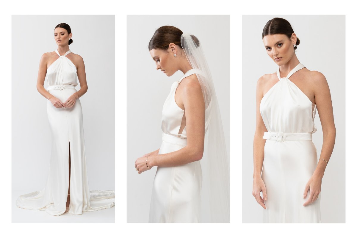 The Tammy gown by Karen Willis Holmes, a high neckline, simple satin bias cut wedding dress with a split skirt.