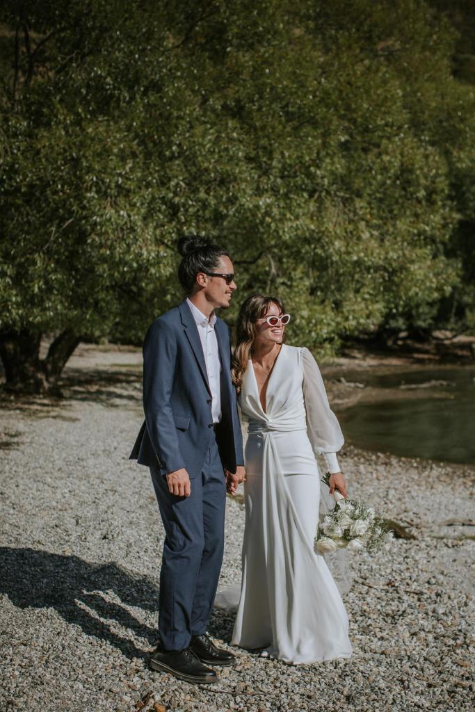 Olive-by Karen Willis Holmes. Bride and groom holding hands while they take in the breathless views in New Zealand