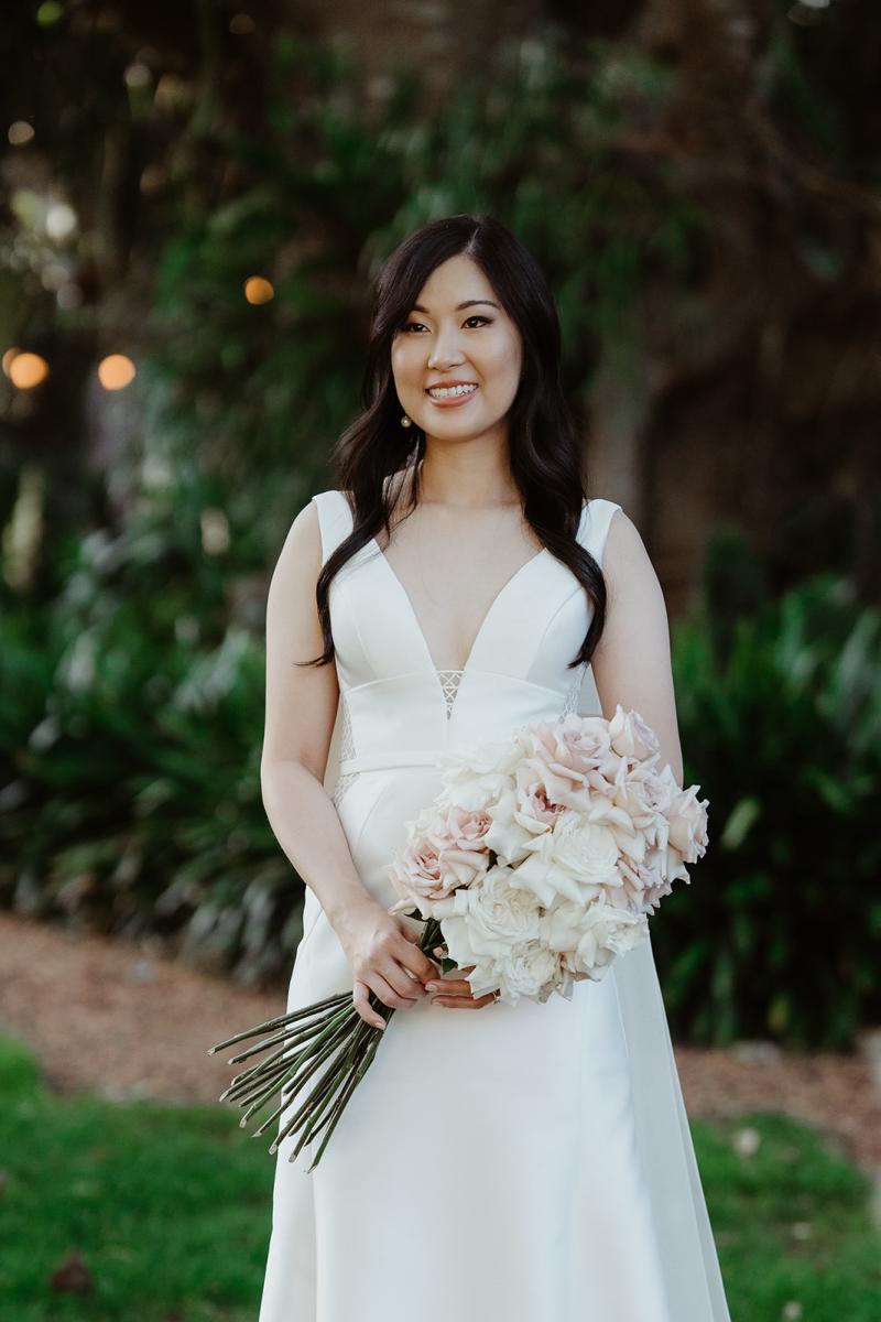 Shelly Samantha Bridal Gown by Karen Willis Holmes-A V neck traditional-portrait with pink bouquet-Carly Kelly Photography