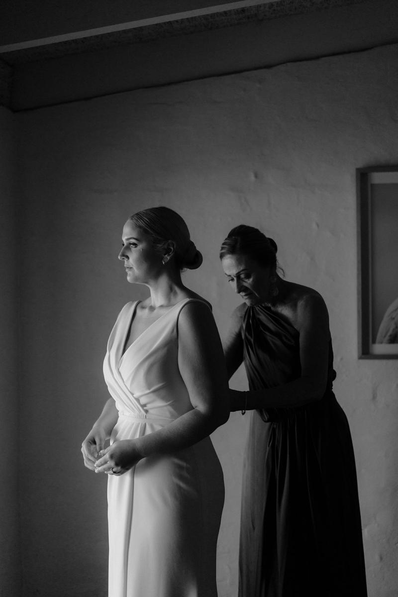 Nikki-Karen Willis Holmes- Bride Eloise has chosen the classic Nikki curvw gown from the WILD HEARTS collection, which is a backless simple wedding dress