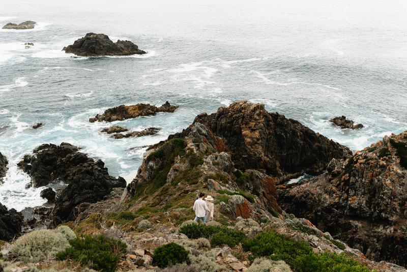 Taryn Camille_Karen Willis Holmes_Emma & Emily - Brides adventuring on by the water and cliffs before their elopement