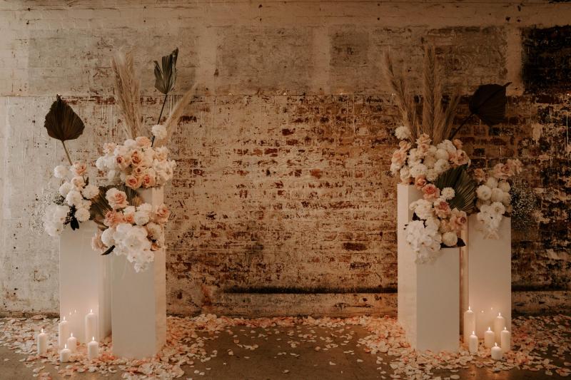 KWH real bride Shenea's alter flowers in pale pinks and white orchids by Sam Burnell.