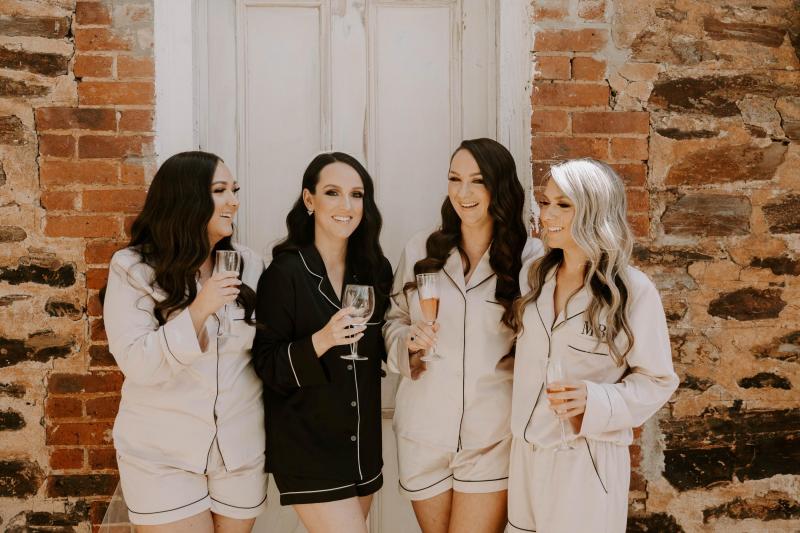 KWH real bride Shenea in black silk pj's and her bridesmaids in pink silk matching ones.