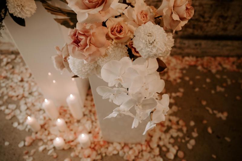 KWH real bride Shenea's alter flowers in pale pinks and white orchids by Sam Burnell.