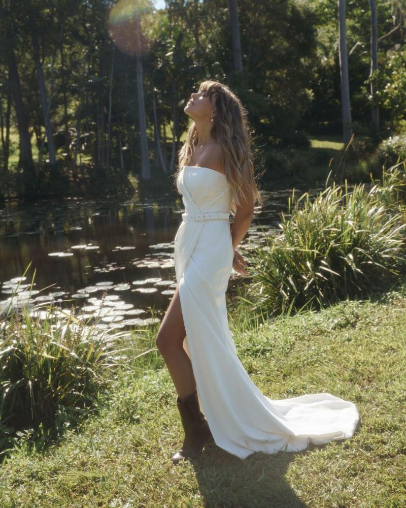 The Drew gown by Karen Willis Holmes, a strapless, straight neckline wedding dress with a fit and flare shape.