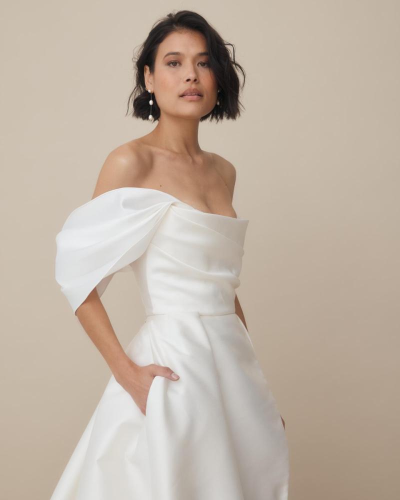 The Jaimee wrap, a bridal accessory worn as a sleeve with the Lou Lou Elizabeth gown by Karen Willis Holmes