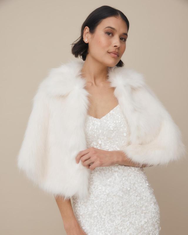 Nord Cape by Unreal fur-a modern wedding cover up made from faux fur worn with the Anya beaded bridal mini