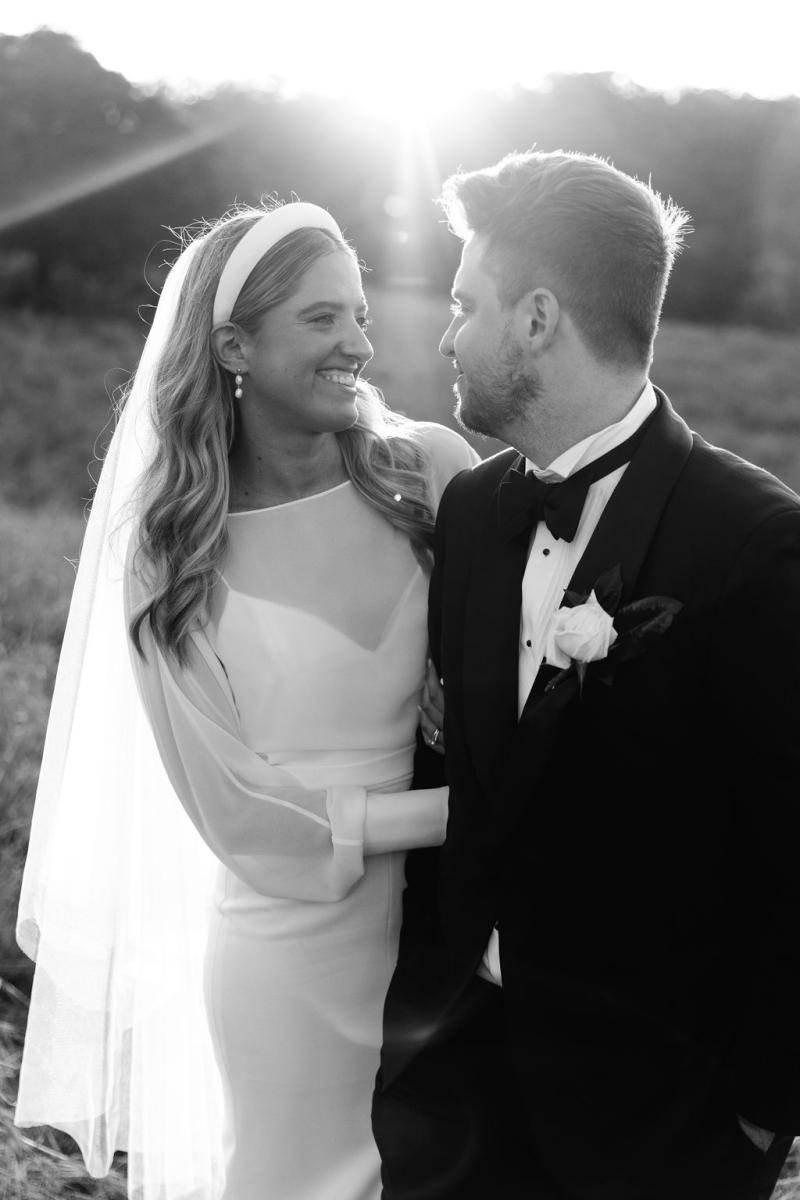 Brie-Karen Willis Holmes - Taylor & Angus - Bride and groom seen sharing their love after their ceremony and exchanging their vows, amongst the hills for their wedding photos. Bride is wearing a classic Head band piece to finish her bridal look.