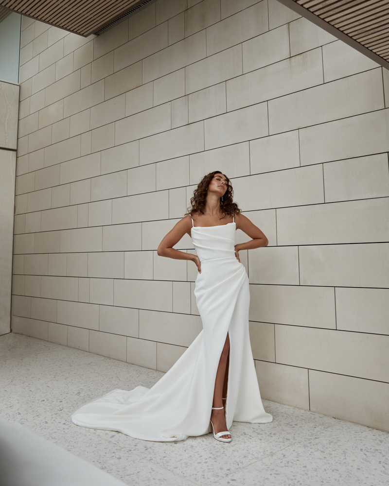 Luella Emily is a modern wedding dress with bodice and skirt pleating by Karen Willis Holmes for the 2023 Bridal Campaign