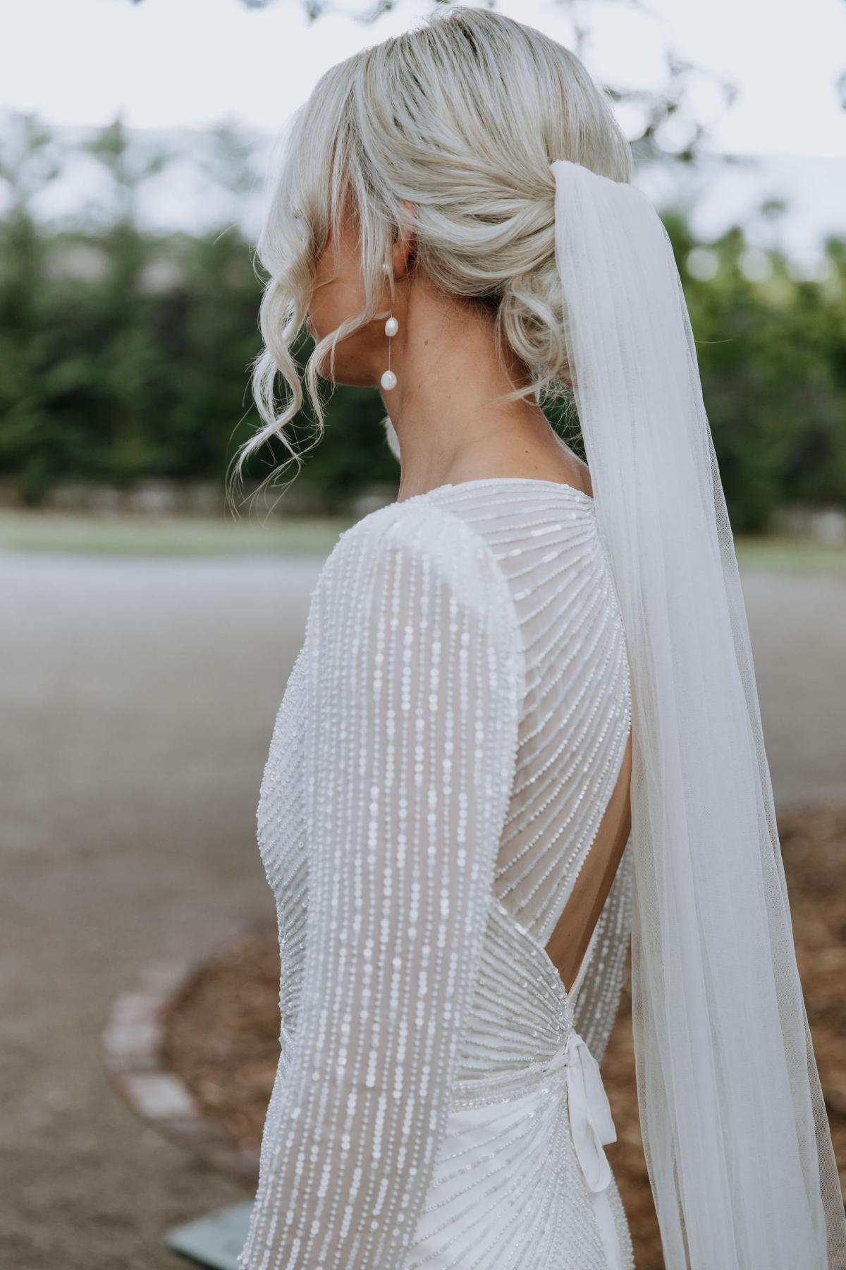 Perry - Karen Willis Homes - Laura & Ben - Bride is wearing a classic wedding dress, the Perry gown from the LUXE bridal collection, the perfect balance s sophisticated and elegant wedding dress.