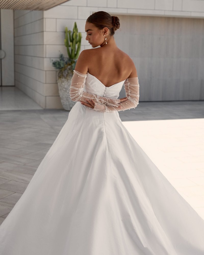 Emma wedding dress made from Silk Shantung paired with our pearl Erin gloves.