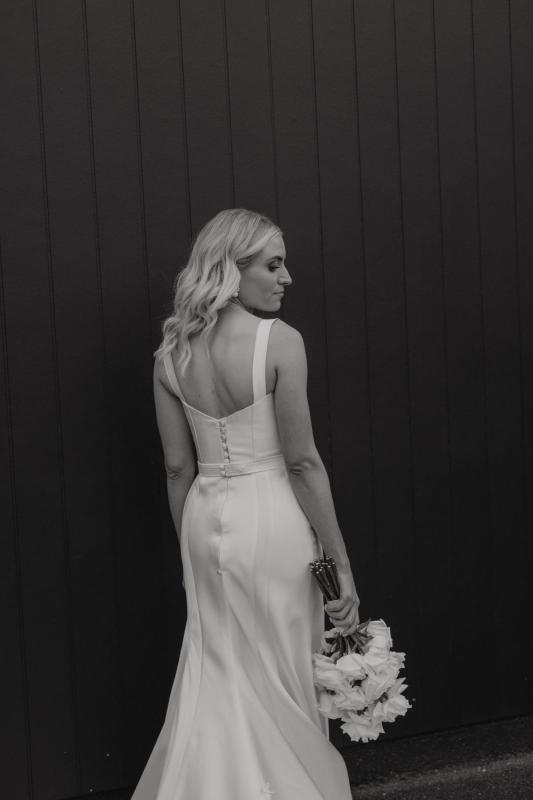 KWH real bride Abbie wears the Blake & Prea gown by Karen Willis Holmes, a modern structured wedding dress in satin mikado featuring a corseted bodice