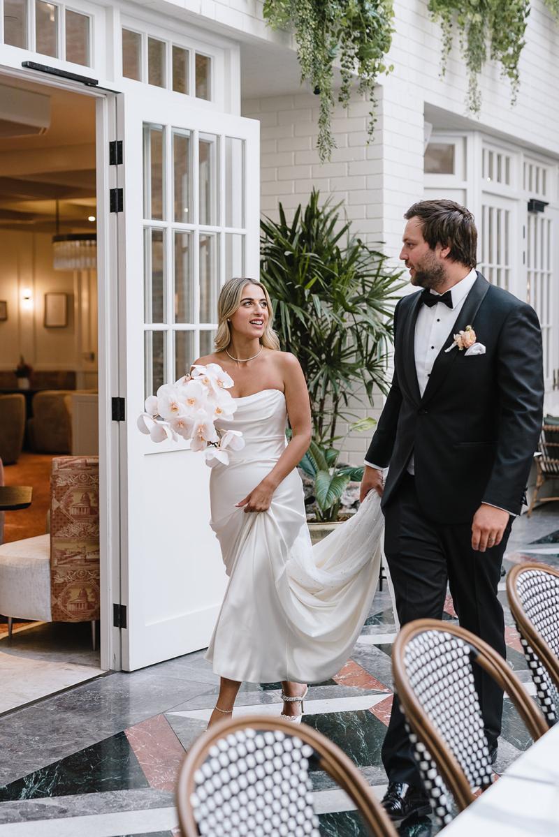 CEO of Bangn body, Priscilla Hajiantoni wears the Tiffany Bridal Gown by Karen Willis Holmes to her Sorrento wedding. Photographed by Wild Romantics photography