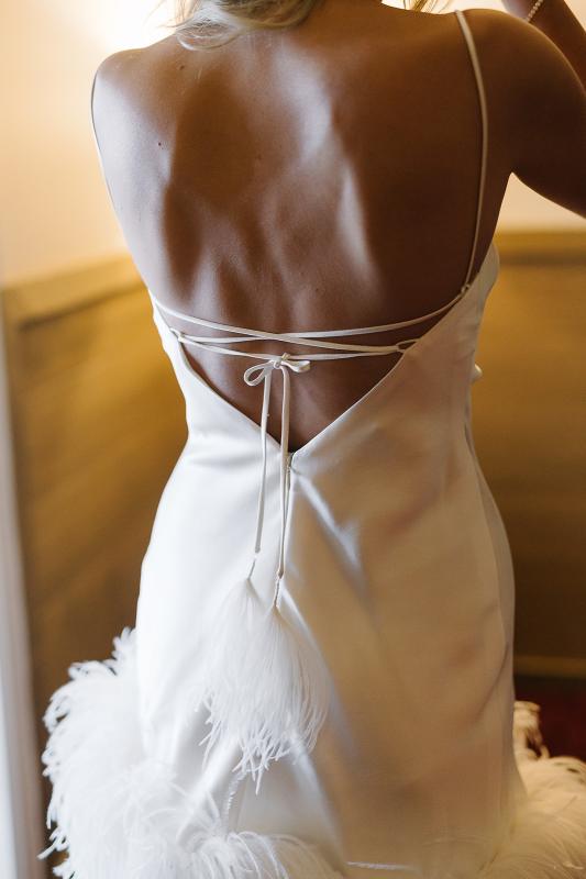 CEO of Bangn body, Priscilla Hajiantoni wears the Sherry mini bridal Gown by Karen Willis Holmes to her Sorrento wedding. Photographed by Wild Romantics photography