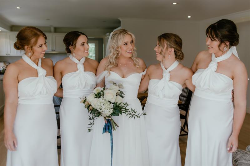 KWH bride Caity wearing the ivory Audrey gown with her bridesmaids.
