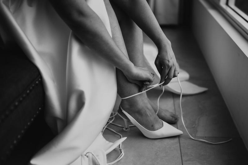 Bridal heels being put on by KWH bride wearing the Blake & Camille wedding dress