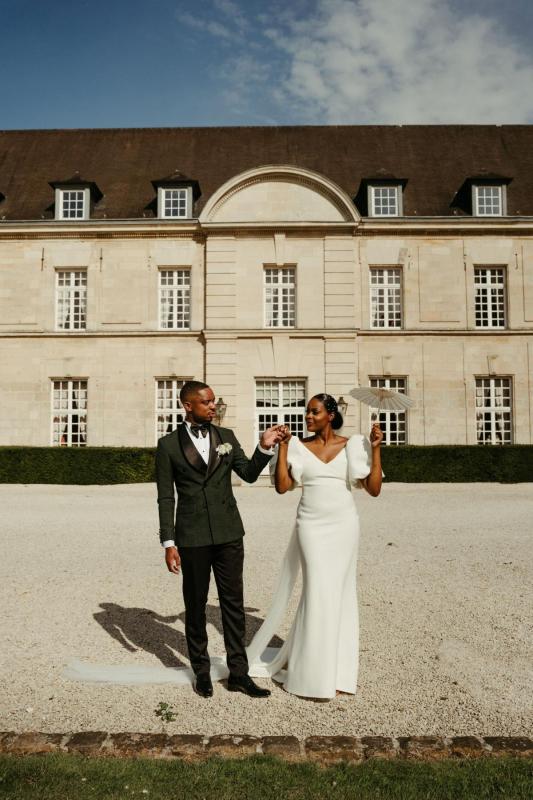 Karen Willis Holmes Real Bride Noémie wearing her Shelby gown from the Elope Collection with statement bubble sleeves and low V back to her France wedding.