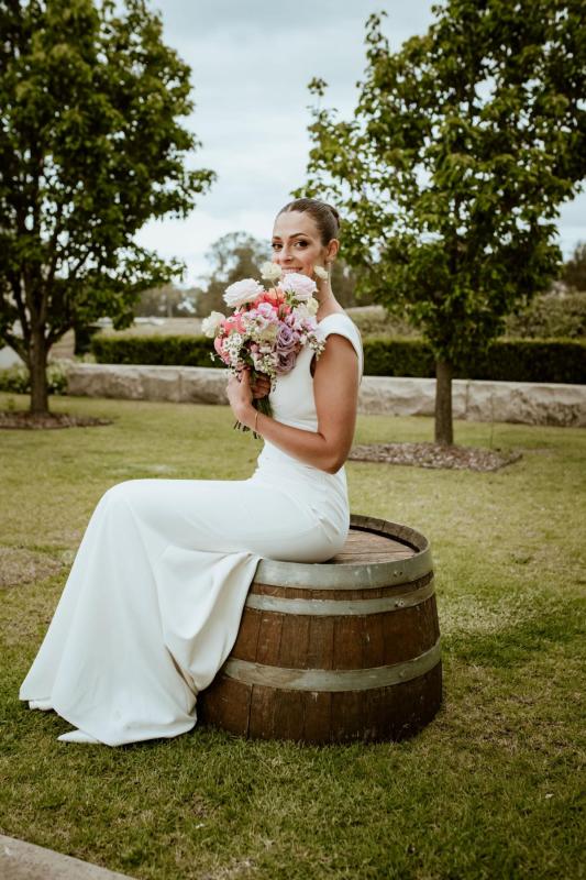 Karen Willis Holmes Real Bride Olivia & Rhys wearing her Arabella gown from the Wild Heart Collection with a beautfiul v-neckline. Olivia had a romantic rustic wedding at Bimbadgen Palmers Lane. Photographed by Night-Jar photography.