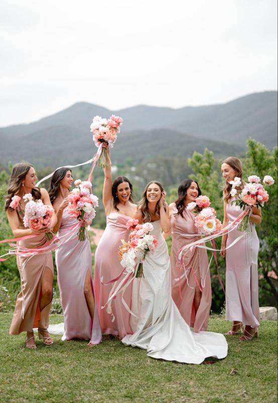 Karen Willis Holmes Real Bride Chloe wearing her Emma gown from the Bespoke Collection with a draped scoop neck bodice with spaghetti straps, A-line skirt and statement split. Chloe had a pink romantic wedding at Hubert Estate photographed by Ashleigh K Weddings.
