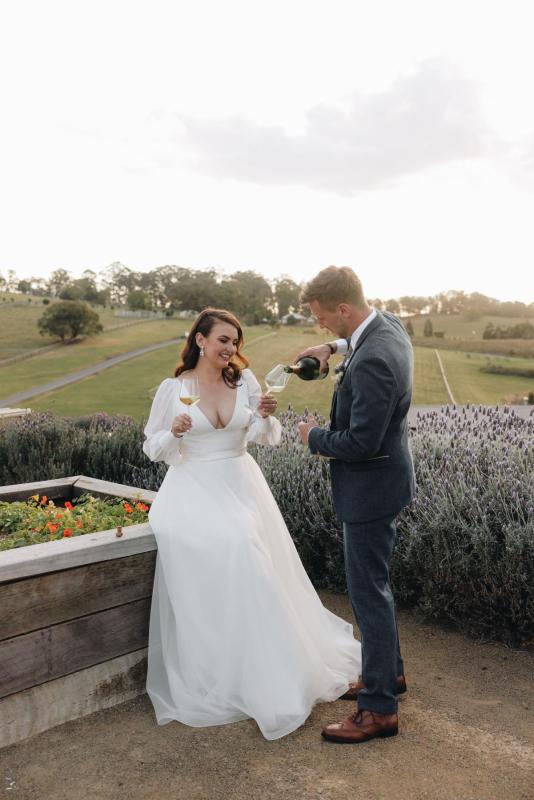Karen Willis Holmes Real Bride Alex is wearing her Taryn & Joni gown from the BESPOKE Collection. Alex had a Picture Perfect wedding Beechmont Estate located in Queensland. Photographed by Aleisha Edwards.