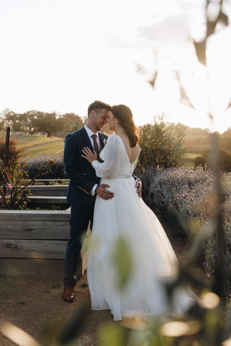 Karen Willis Holmes Real Bride Alex is wearing her Taryn & Joni gown from the BESPOKE Collection. Alex had a Picture Perfect wedding Beechmont Estate located in Queensland. Photographed by Aleisha Edwards.