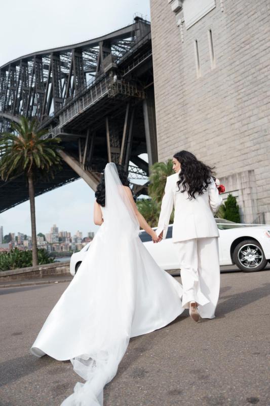 Karen Willis Holmes Real Bride Dana is wearing the Charlie & Danielle Bridal suit from the ELOPE Collection. Dana Exchanged her vows overlooking Sydney's Harbour located at Pier One. Photographed by Salt Atelier.