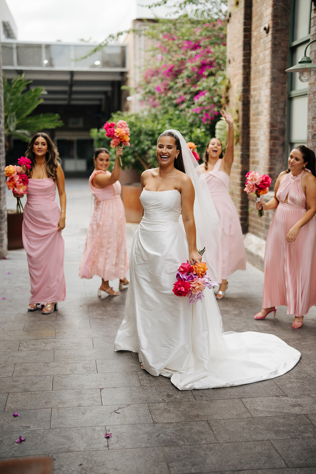 Karen Willis Holmes Real Bride Ariella is wearing the Emma Gown from the BESPOKE Collection. Ariella had her iconic wedding in The Grounds of Alexandria, Photographed by Hello Sweetheart Au.